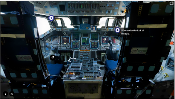 The interior of the space shuttle Atlantis main flight deck, Facing the front control panel, from behind the two commanders’ chairs, overlaid by several icons signifying interactivity..