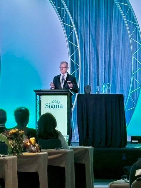 Tim Porter-O'Grady onstage during the Sigma Awards ceremony accepting the Nell J. Watts Lifetime Achievement in Nursing Award.
